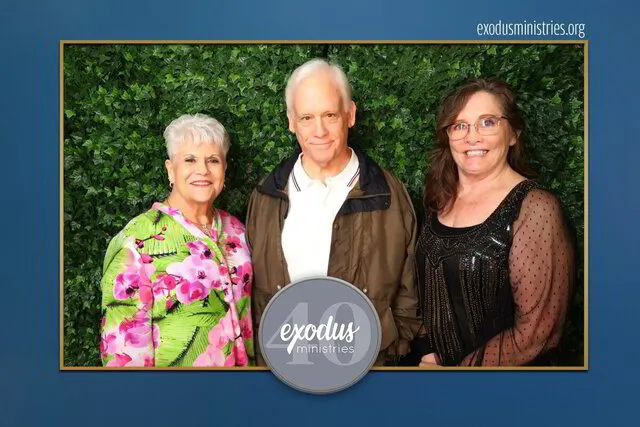 three people posing for a photo portrait studio in a corporate event