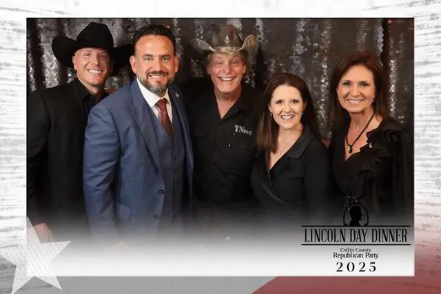five people smiling for a photo portrait studio in a corporate event