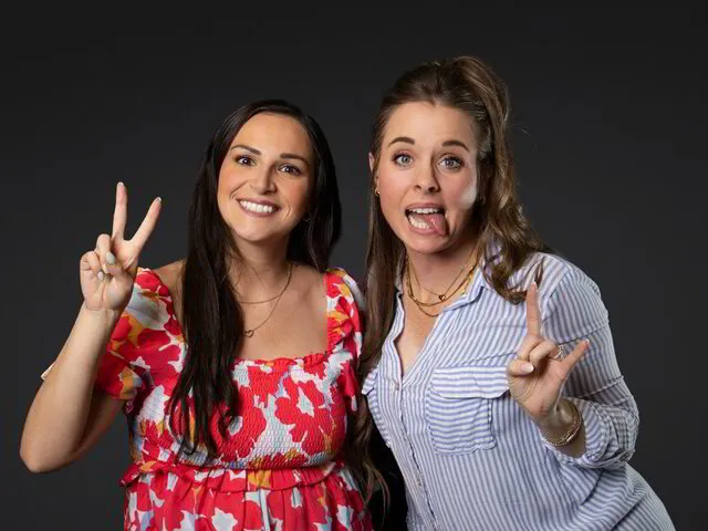 two women posing for a photo portrait studio