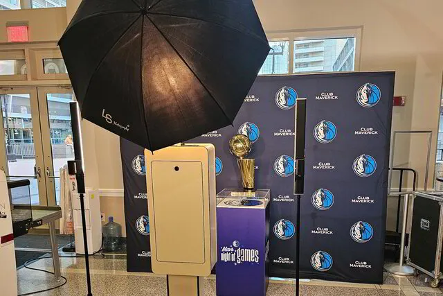 open air photo booth with branded step and repeat backdrop at American Airlines Center