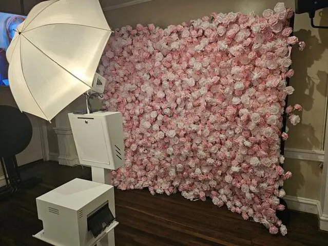 open air photo booth with pink floral backdrop