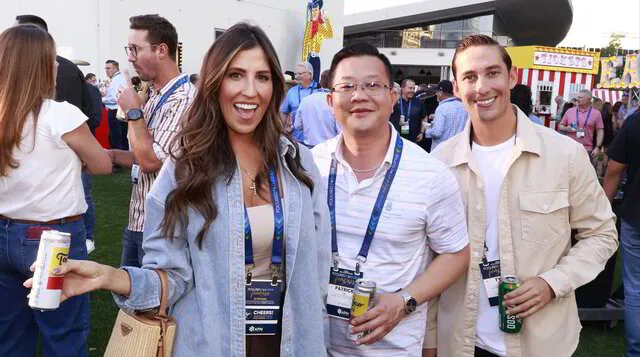 three colleagues enjoying an outdoor corporate welcome reception in Texas during the Fall.
