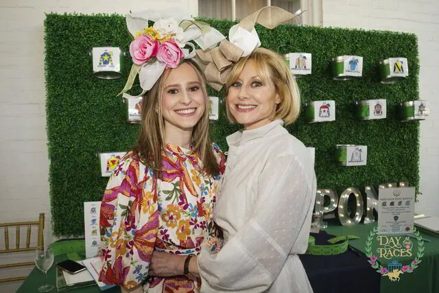 two women smiling and posing for an event photography in a party in austin texas